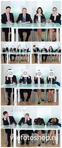 People in suits miss at a table /      