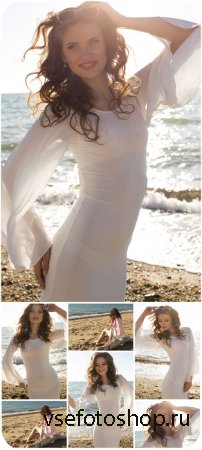        / Girl in white dress on the beach -  ...
