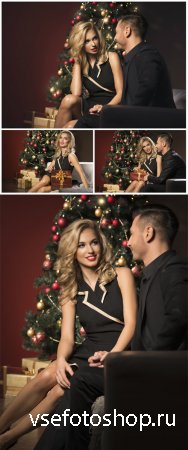 Couple in love at Christmas tree - Stock Photo
