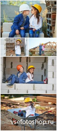 Little kids at a construction site - Stock Photo