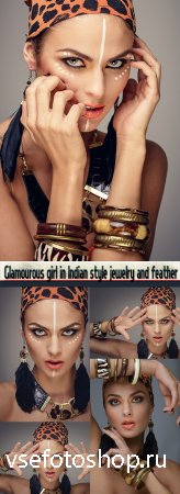 Glamourous girl in Indian style jewelry and feather