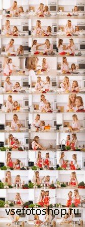      -   / Mother and daughter in the kitch ...